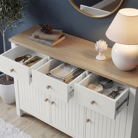 [White] Linra 135cm sideboard with top drawer open showing interior storage depth and accessories on oak top