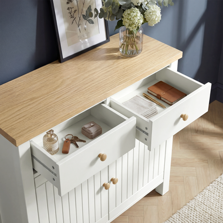 [White] Linra 80cm sideboard in a living room setting with decorative accessories arranged on oak veneer top