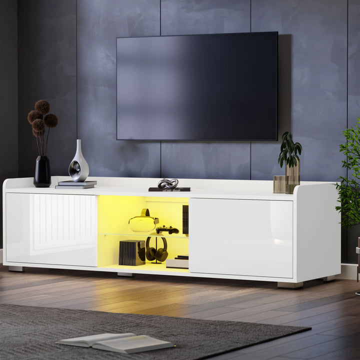 [White] white TV unit with both side flap doors open showing yellow-lit interior storage and decor on top