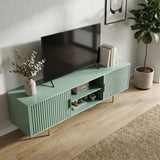 Green TV stand with fluted doors styled in a modern lounge, featuring home decor for a contemporary aesthetic.