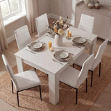 Top view of modern 4-6 seater white dining table and chairs set with neutral decor. Perfect for contemporary kitchen and dining furniture setups.