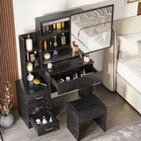 Black dressing table with storage, drawers, and mirror in modern bedroom. Features cushioned stool, open shelves, and sliding mirror panel.