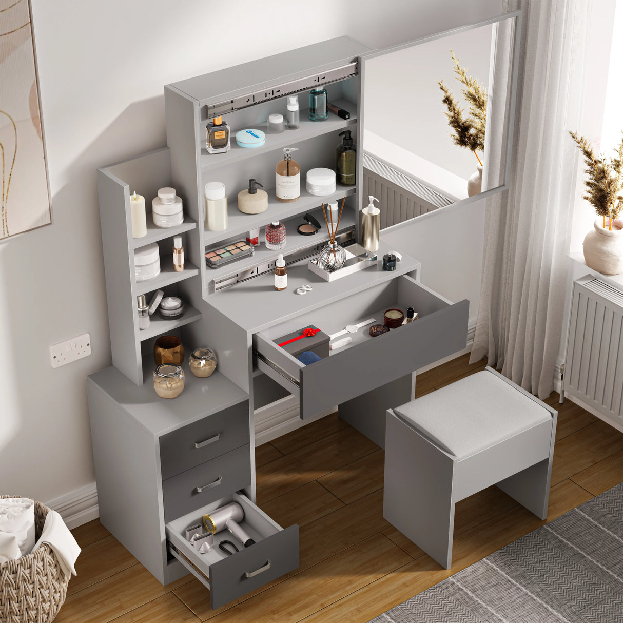 Dressing Table with Storage, Drawers and Mirror, Vanity Makeup Table in grey finish featuring multiple drawers, open shelves, and cushioned stool. Ideal for organizing cosmetics and beauty essentials in modern bedrooms.