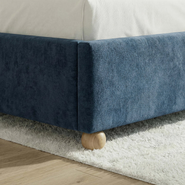 [Blue | Double] Round wooden ball foot at velvet base corner sitting on light hardwood floor with white shag rug behind