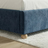 [Blue | King] Close-up of spherical natural wood leg supporting the velvet padded bed base on pale floor