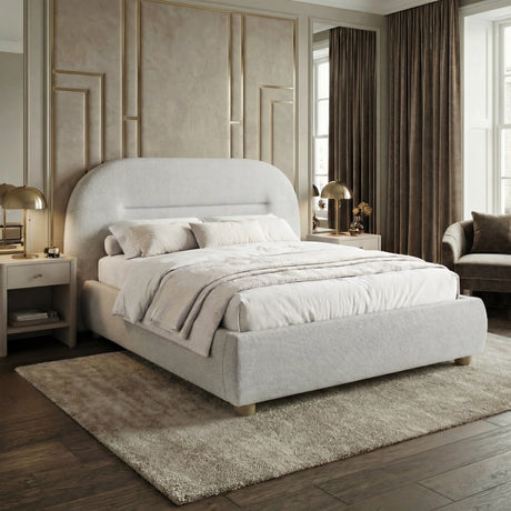 [Grey | Double] Angled shot of upholstered bed frame showing full depth with layered bedding beside lamp and velvet chair