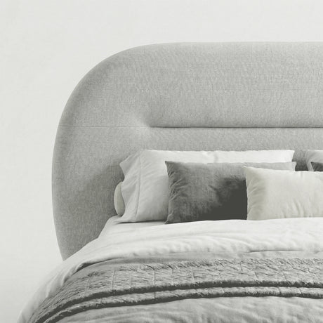 [Grey | Double] Side view of rounded headboard showing arch curve and channel seam with layered scatter cushions on the bed