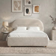 [Beige | Double] Arch headboard bed frame with bedding positioned against textured wall with 4 framed abstract prints above