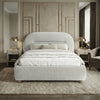 [Grey | Double] Arch headboard bed frame dressed with white and neutral bedding on deep shag rug below decorative wall