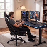 [Black + White] Side view of a man playing video games while seated in the Ergonomic Gaming Chair.