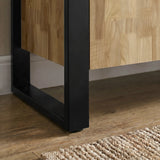 [Mango Wood Effect] Ironmere sideboard black metal frame detail showing side panel, square leg, lower rail, floor, and rug.