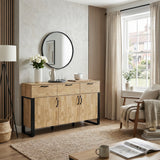 [Mango Wood Effect] Ironmere window room view with closed drawers and doors, round mirror, vase, table lamp, rug, and sofa.