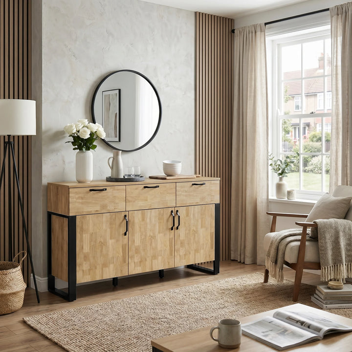 [Mango Wood Effect] Ironmere window room view with closed drawers and doors, round mirror, vase, table lamp, rug, and sofa.