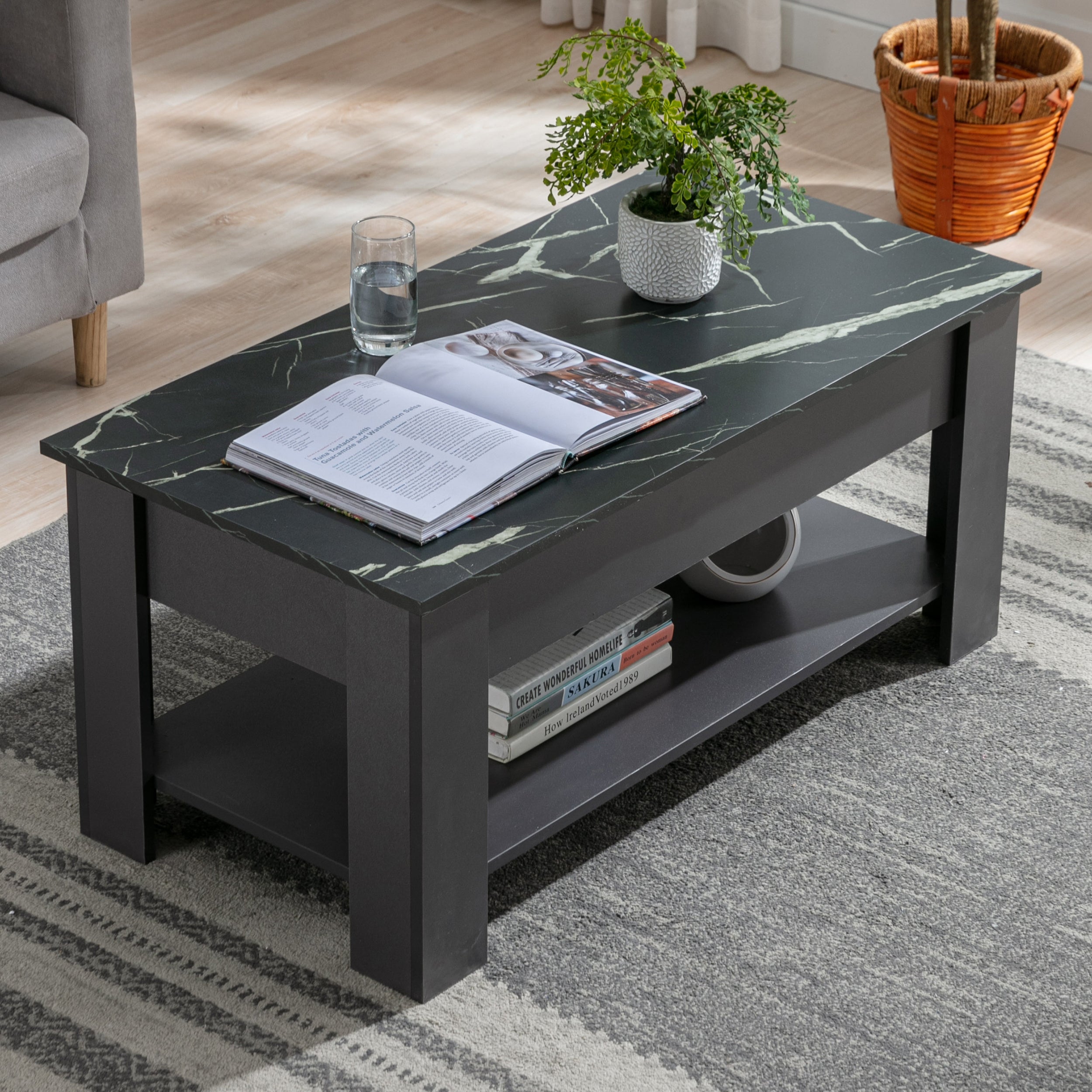 Black coffee table with marble top, stylish design and storage shelf for living room use.