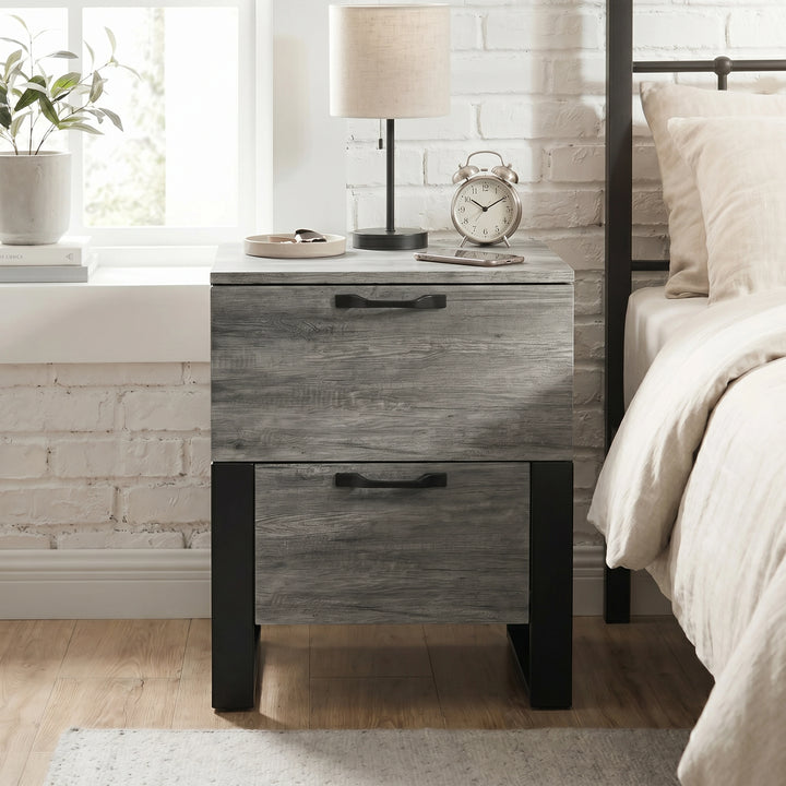 [Wooden Grey] Millwright industrial 2-drawer bedside table beside a metal bed in a bedroom showing unique hanging effect