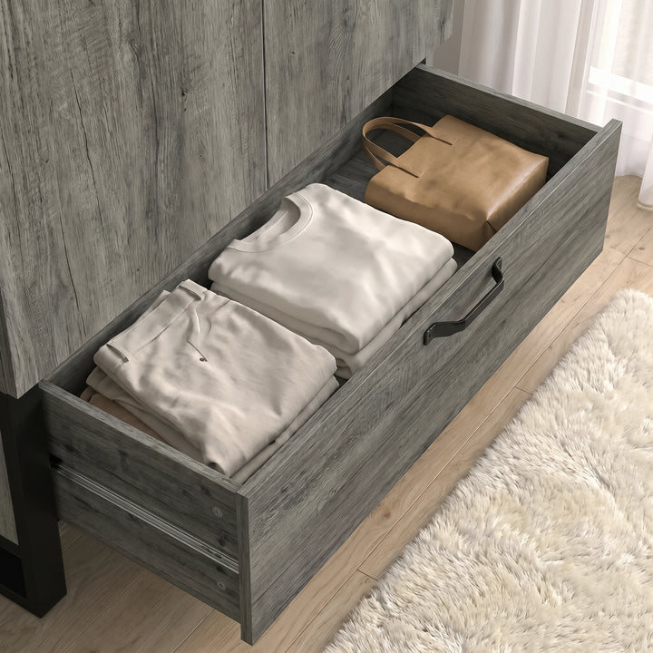 [Wooden Grey] Millwright 2 door wardrobe bottom drawer pulled open with folded clothing and bedding storage