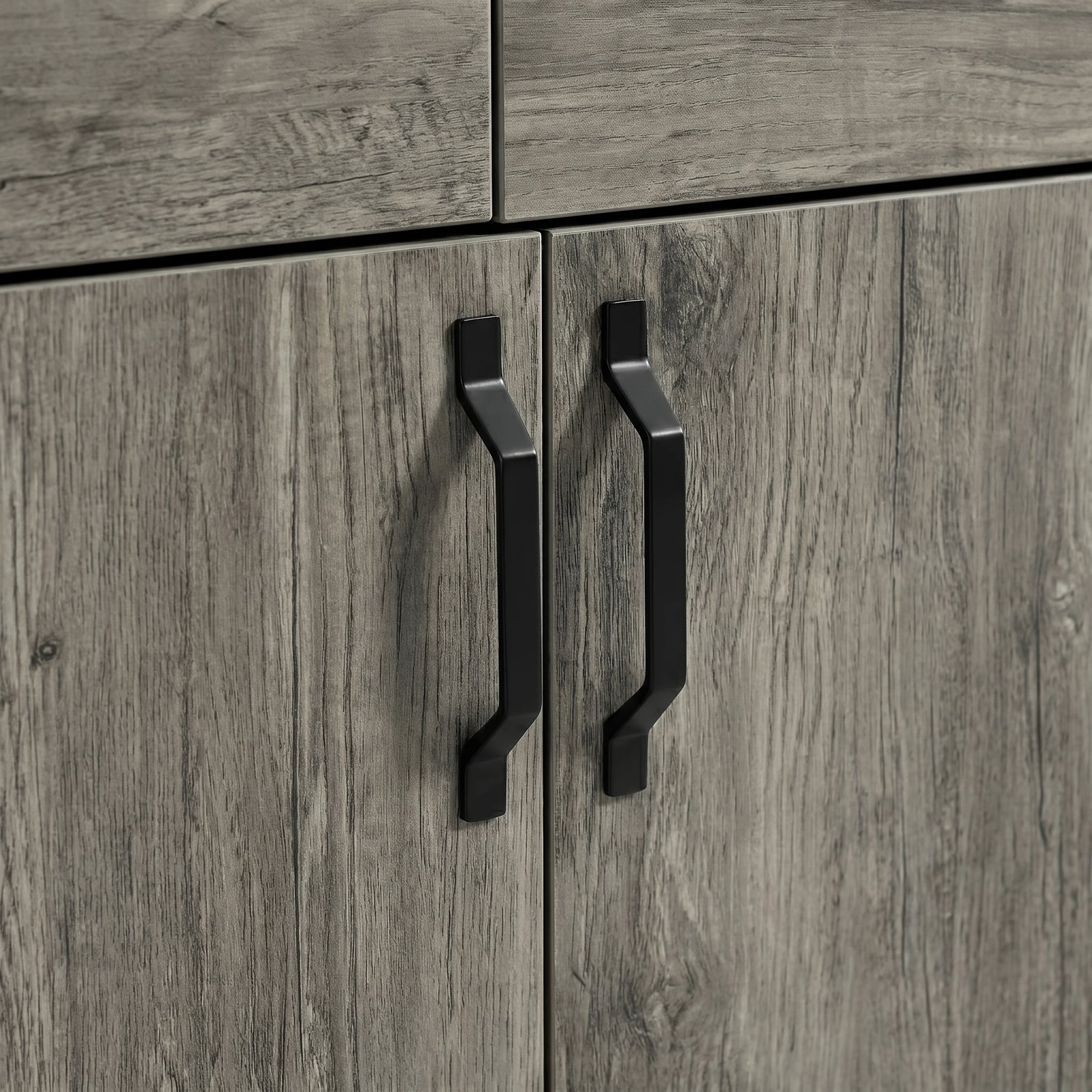 [Wooden Grey] Millwright sideboard close-up showing black angular handles on wooden grey doors
