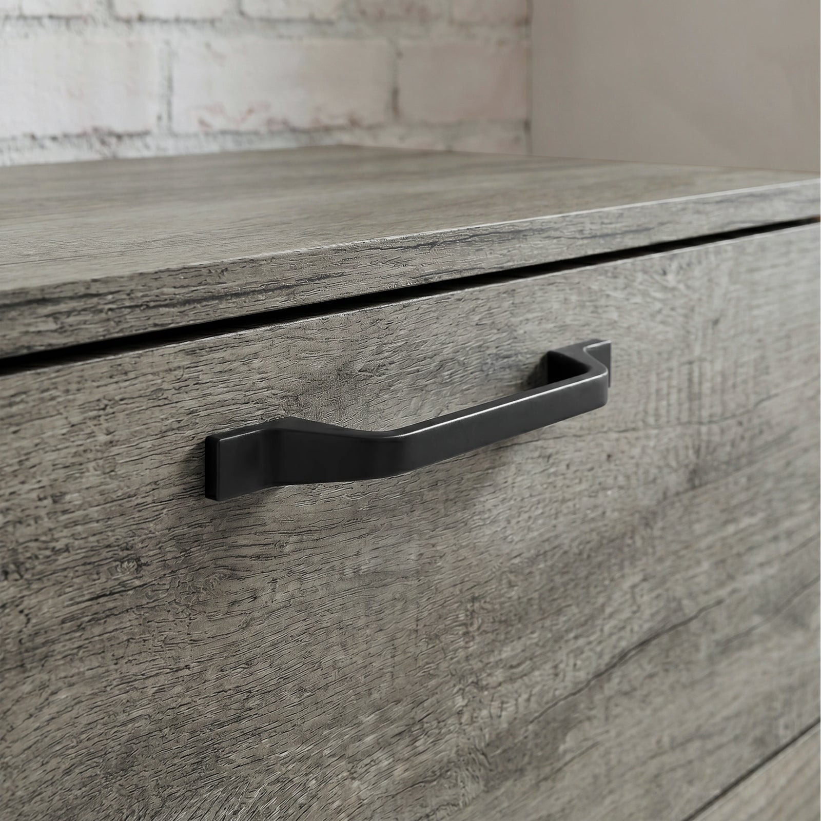 [Wooden Grey] Millwright chest of drawers close-up showing black handle on wooden grey drawer front