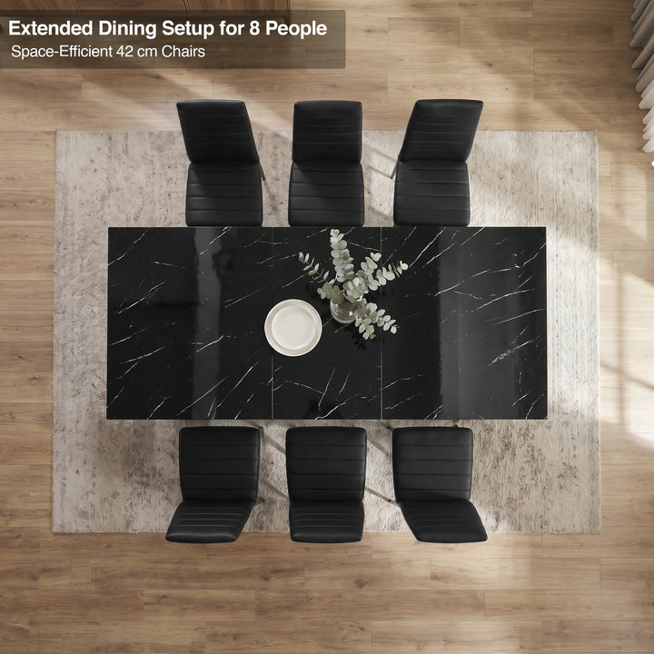 [6 Seater | Black] Overhead view of the Milo black marble-effect extended dining table layout with space-efficient chairs