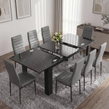 [8 Seater | Grey] Milo black marble-effect table partly opened to show the centre extension leaf and sliding rails