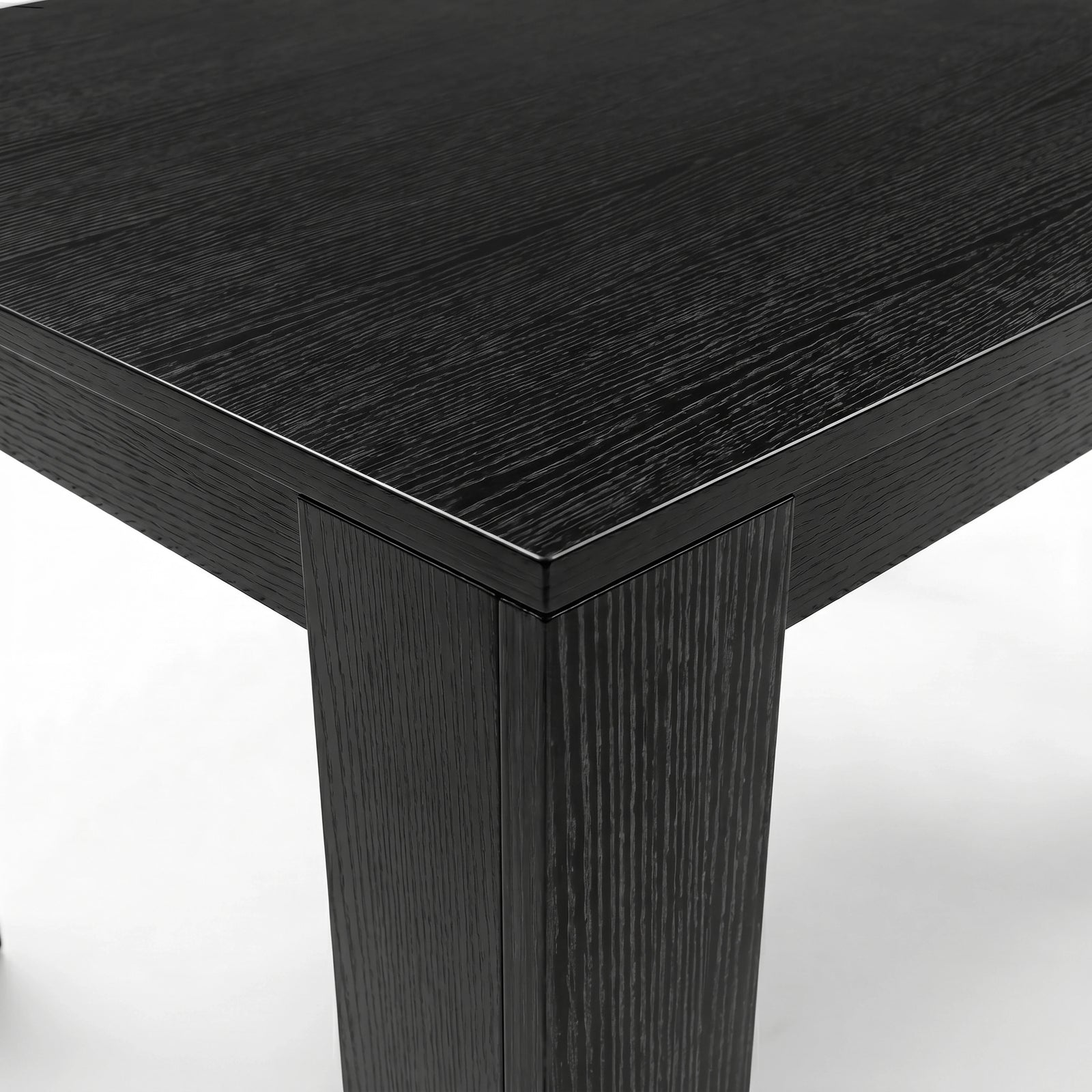 [6 Seater | White] Milo extendable dining table set corner close-up with textured tabletop and inverted L-shaped leg