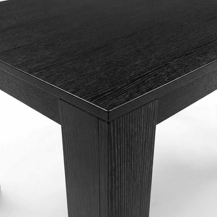 [8 Seater | White] Milo extendable dining table set corner close-up with textured tabletop and inverted L-shaped leg