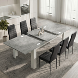 [6 Seater | Black] Milo concrete-effect table partly opened to show the centre leaf and sliding rails