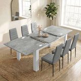 [6 Seater | Grey] Milo concrete-effect table partly opened to show the centre leaf and sliding rails