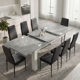 [8 Seater | Black] Milo concrete-effect table partly opened to show the centre leaf and sliding rails
