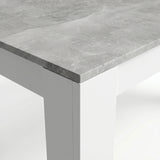 [8 Seater | Black] Close-up of the Milo concrete-effect tabletop edge, surface texture, and white inverted L-shaped leg