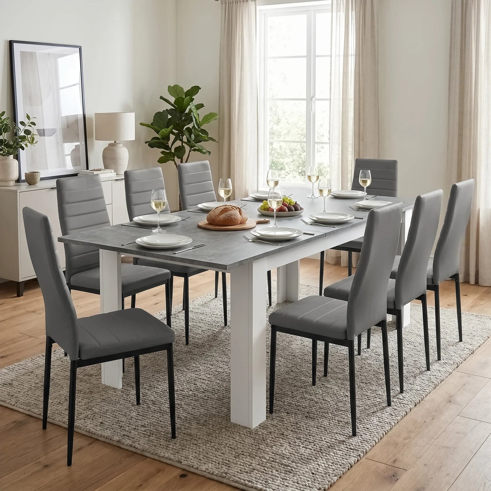 [8 Seater | Grey] Milo concrete-effect dining table set extended to 220cm with 8 grey high-back chairs in a well-lit room.