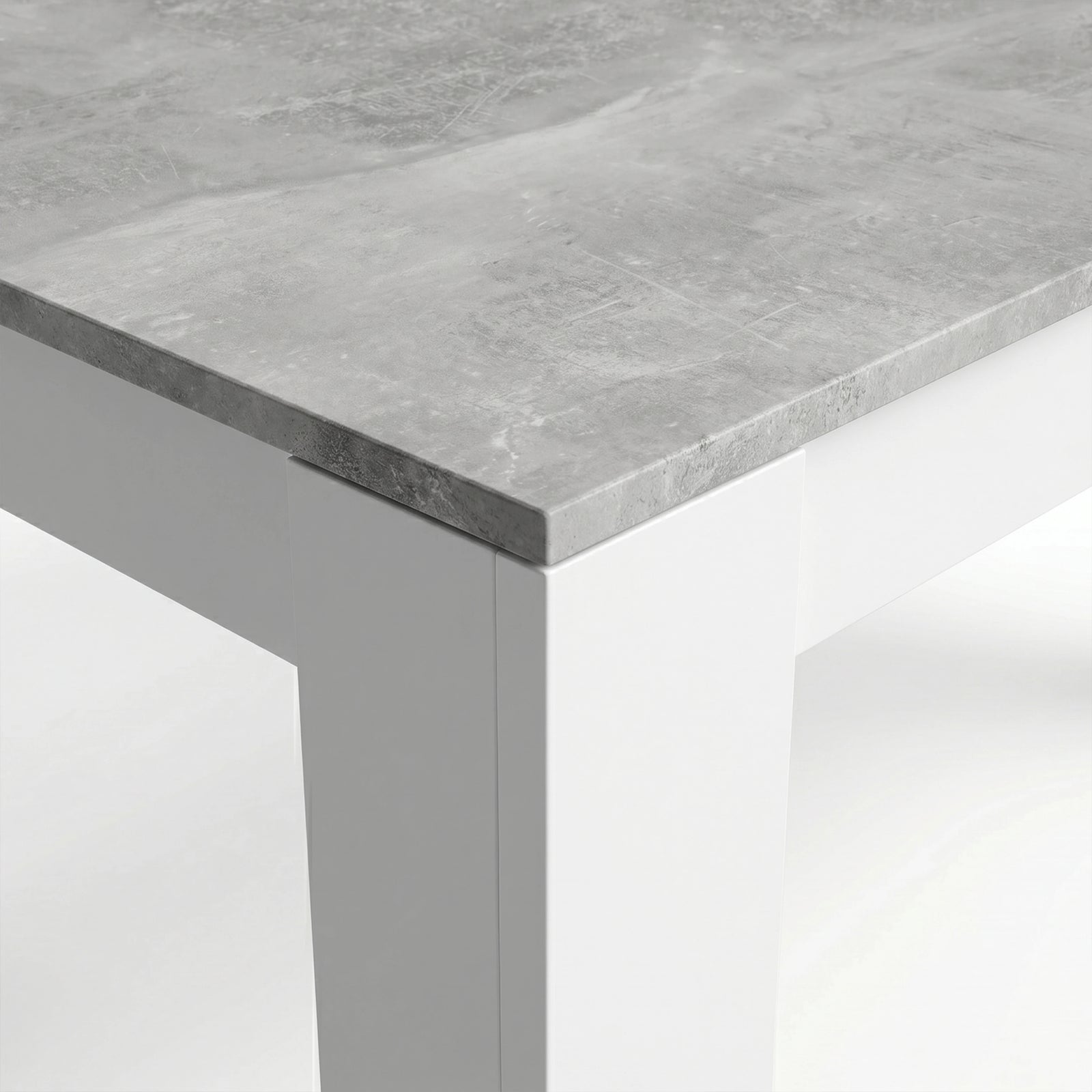 [8 Seater | Grey] Milo concrete-effect tabletop corner close-up showing texture and white inverted L-shaped leg detail
