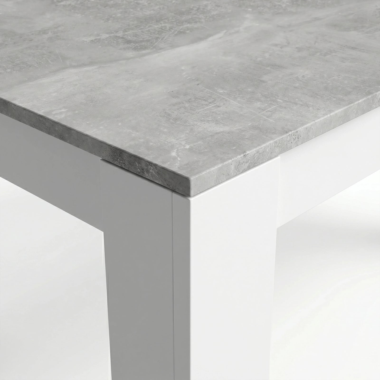 [8 Seater | Grey] Milo concrete-effect tabletop corner close-up showing texture and white inverted L-shaped leg detail