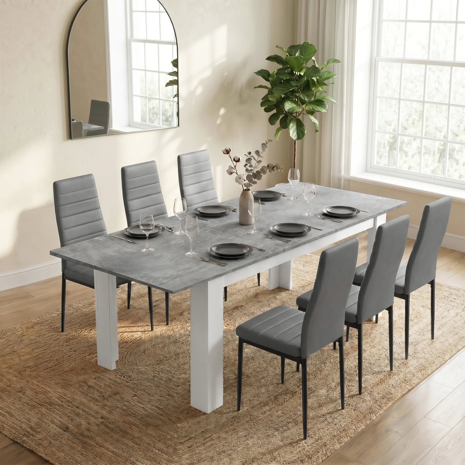 [6 Seater | Grey] Milo Extendable Dining Table Set with 6 Grey Chairs | Concrete Effect styled beautifully in a bright dining room on a woven rug.