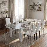 [6 Seater | White] Milo Extendable Dining Table Set with 6 White Chairs in a Concrete Effect finish, styled in a warm dining area.