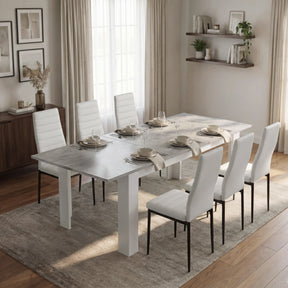 [6 Seater | White] Milo Extendable Dining Table Set with 6 White Chairs in a Concrete Effect finish, styled in a warm dining area.
