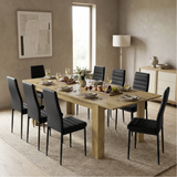 [8 Seater | Black] Milo oak-effect dining table set with 8 high-back chairs in a styled room view
