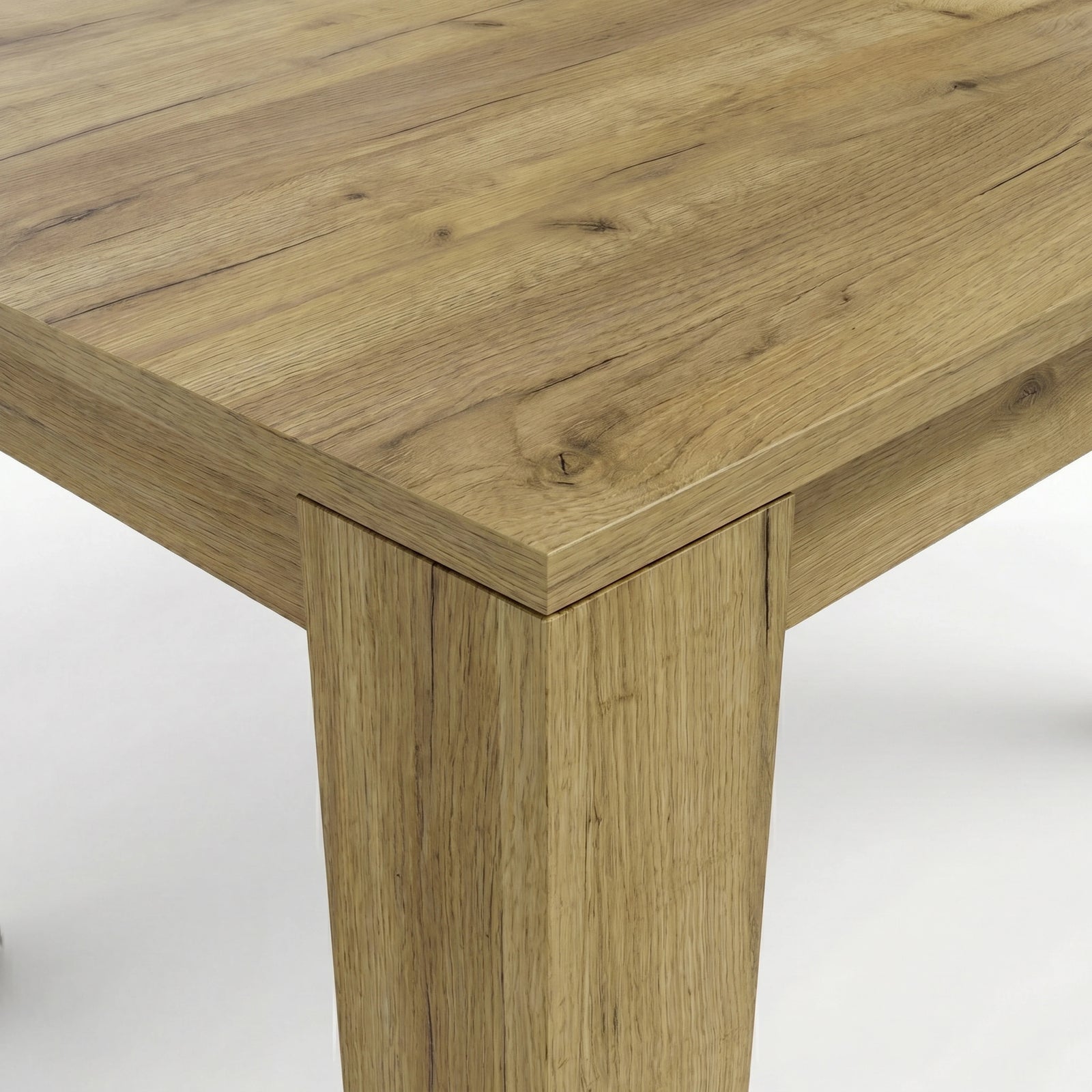 [8 Seater | Grey] Close-up of the Milo oak-effect tabletop corner, wood grain, and inverted L-shaped table leg