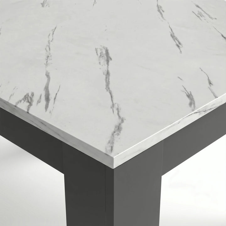 [6 Seater | Black] Close-up of the Milo marble-effect tabletop corner, veining, and inverted L-shaped table leg
