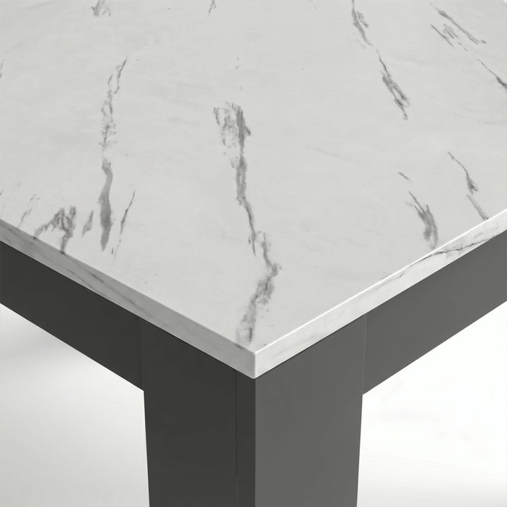 [6 Seater | Black] Close-up of the Milo marble-effect tabletop corner, veining, and inverted L-shaped table leg