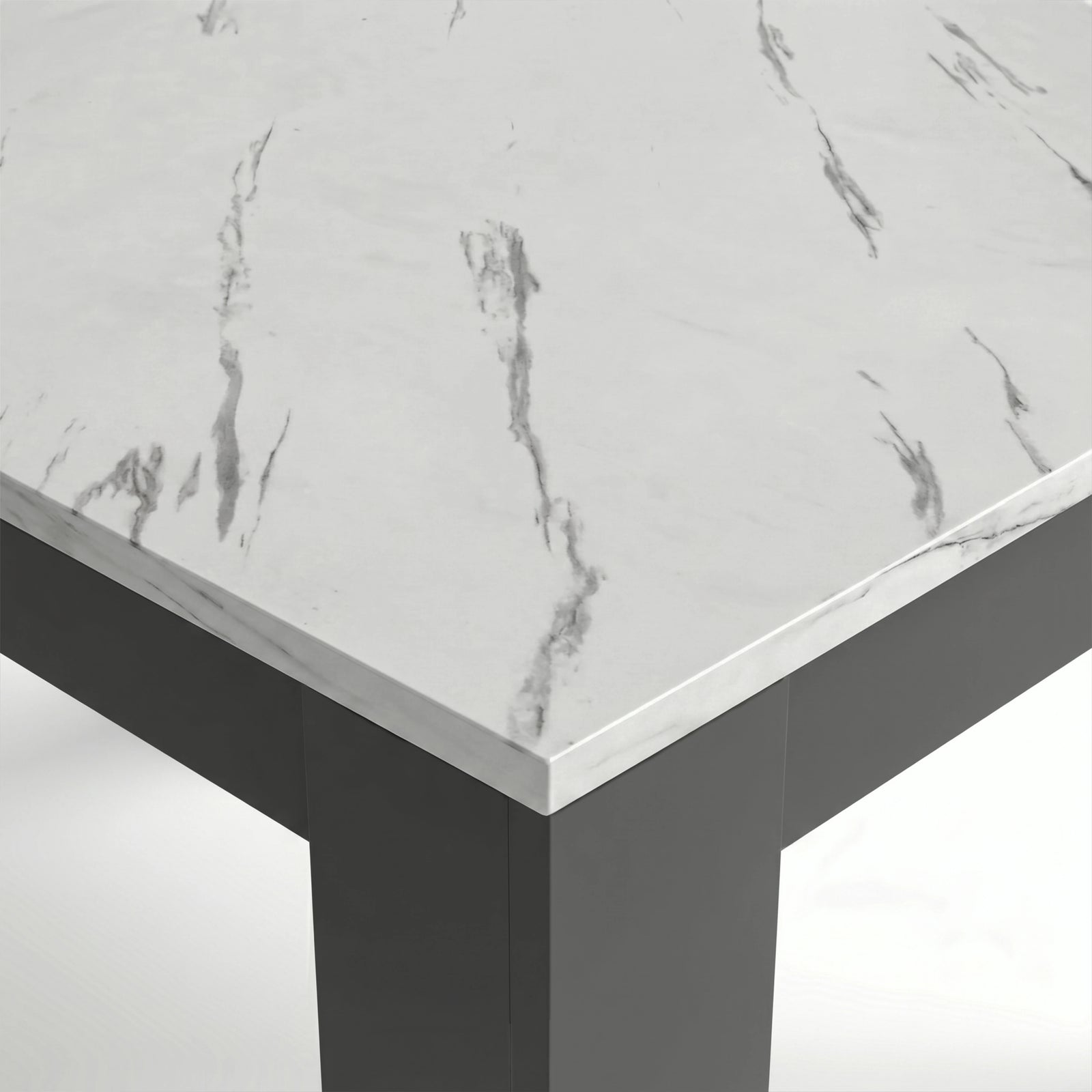 [8 Seater | Black] Close-up of the Milo marble-effect tabletop corner, veining, and inverted L-shaped table leg