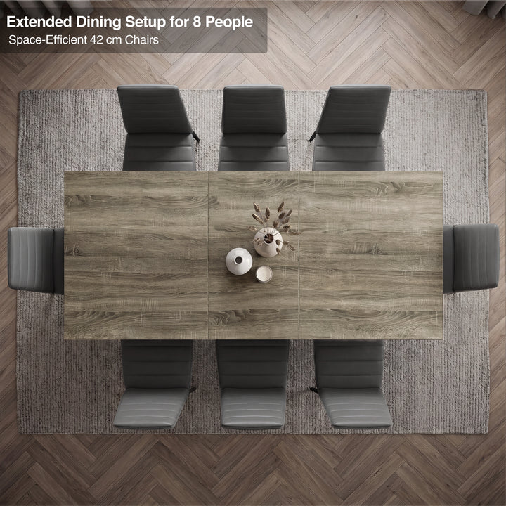 [8 Seater | Grey] Overhead view of the Milo wooden grey-effect extended dining table layout with space-efficient chairs