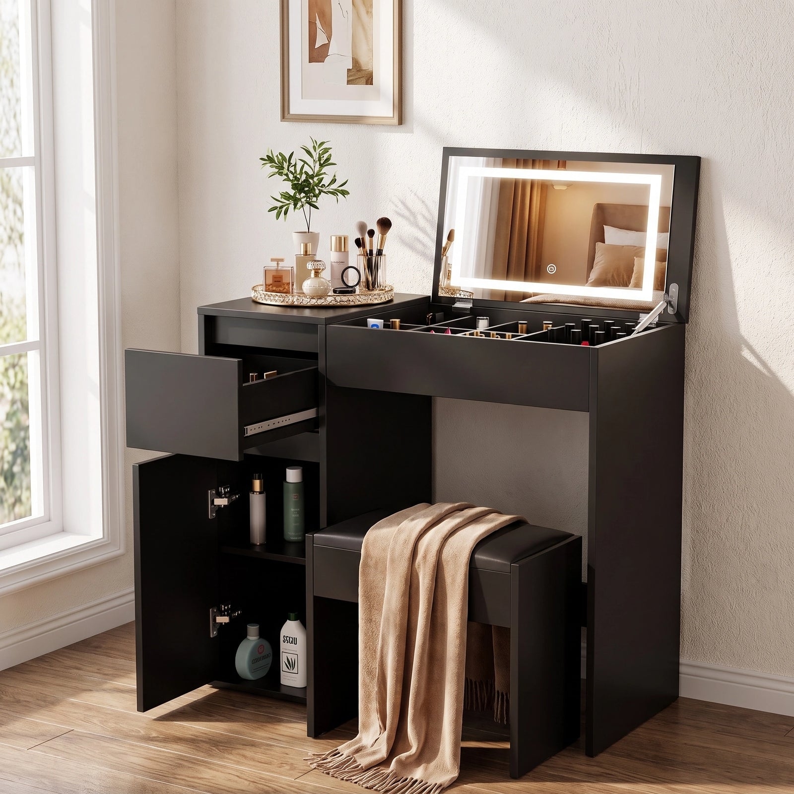 [Black] vanity table with built-in mirror, illuminated LED lighting, drawers, open storage cabinet, and matching stool in a bright room.