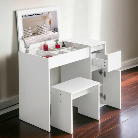 Mirrored dressing table with storage, featuring multiple compartments, drawers, a white finish.