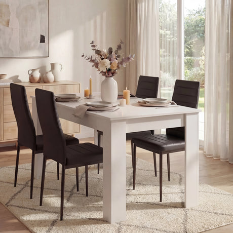 [4 Seater | Black] White 4 seater dining table with four black PU chairs in bright herringbone room