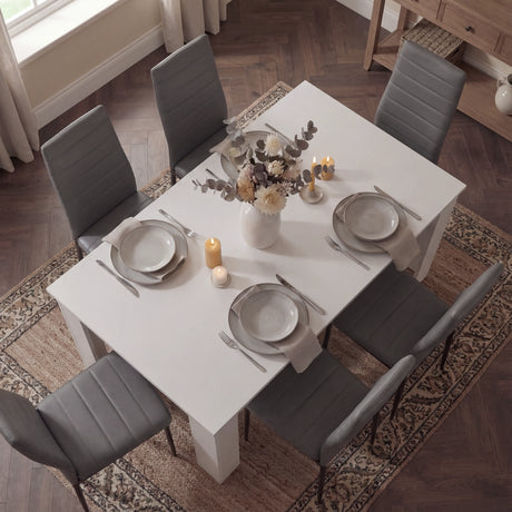 [6 Seater | Grey] Top-down view of 6 seater white table with six grey PU chairs on parquet