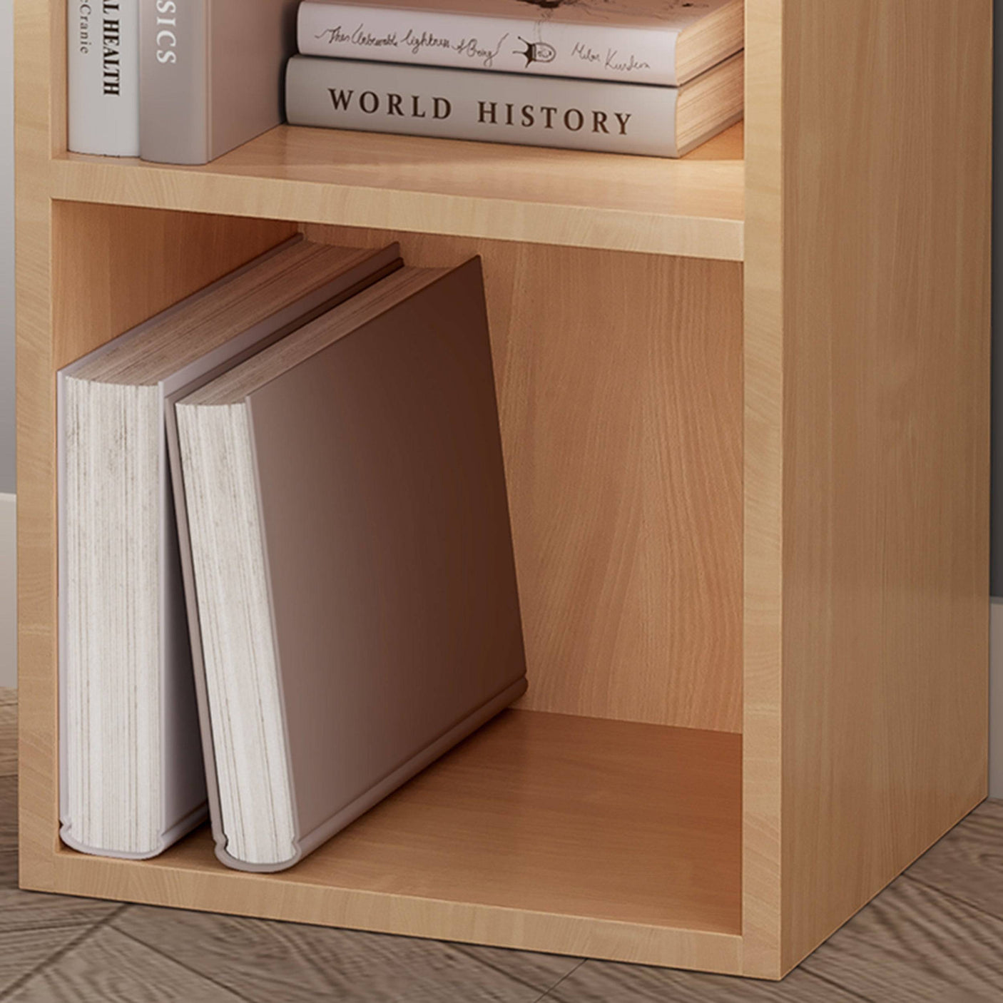 Close-up of bottom shelf on natural wood Blisswood bookcase with large books, clean and sturdy.