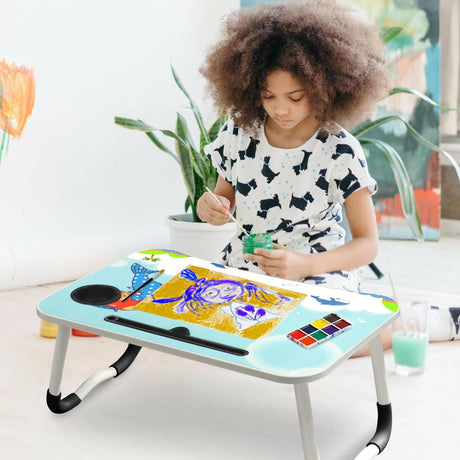 Child painting on a colorful modern desks for home office with cup holder and whale-themed design.