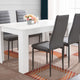 Modern dining table with stylish chairs, ideal for contemporary dining rooms.