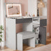 Grey vanity with mirror and storage drawers in a room setting.